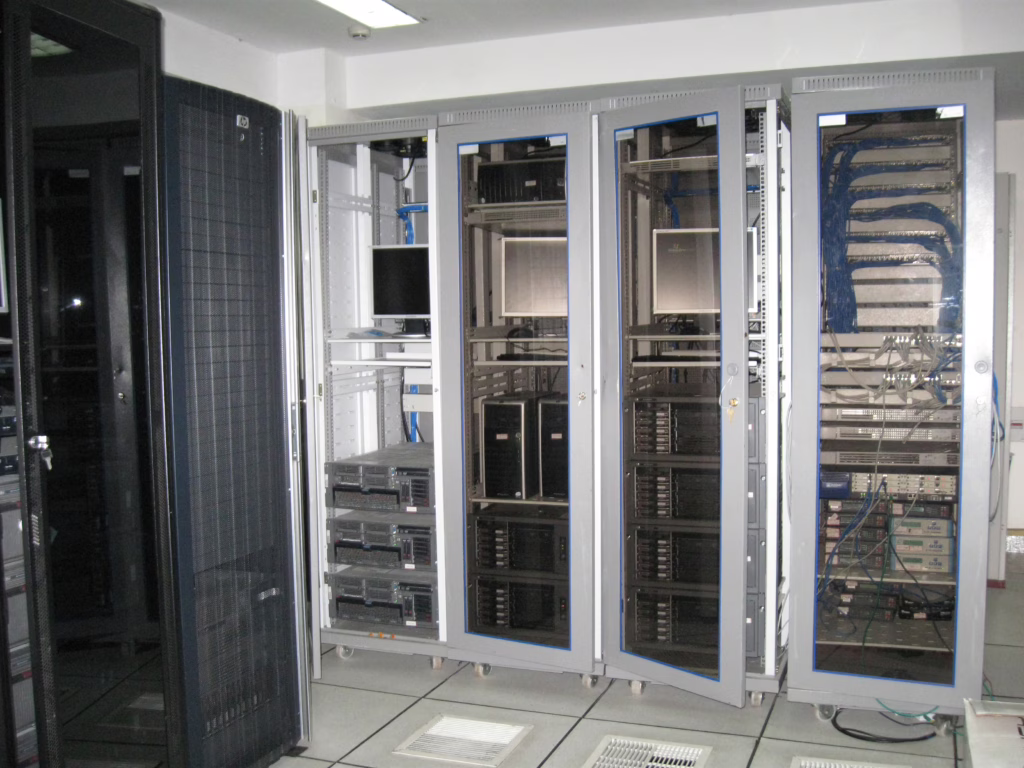 Server room aisle with racks, cabling, and datacenter hardware