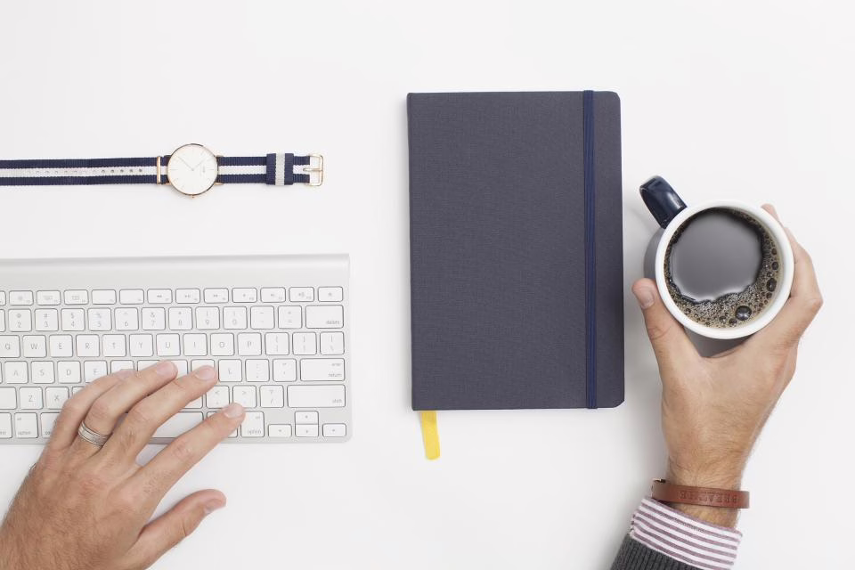 Clean office desk with laptop and organized accessories