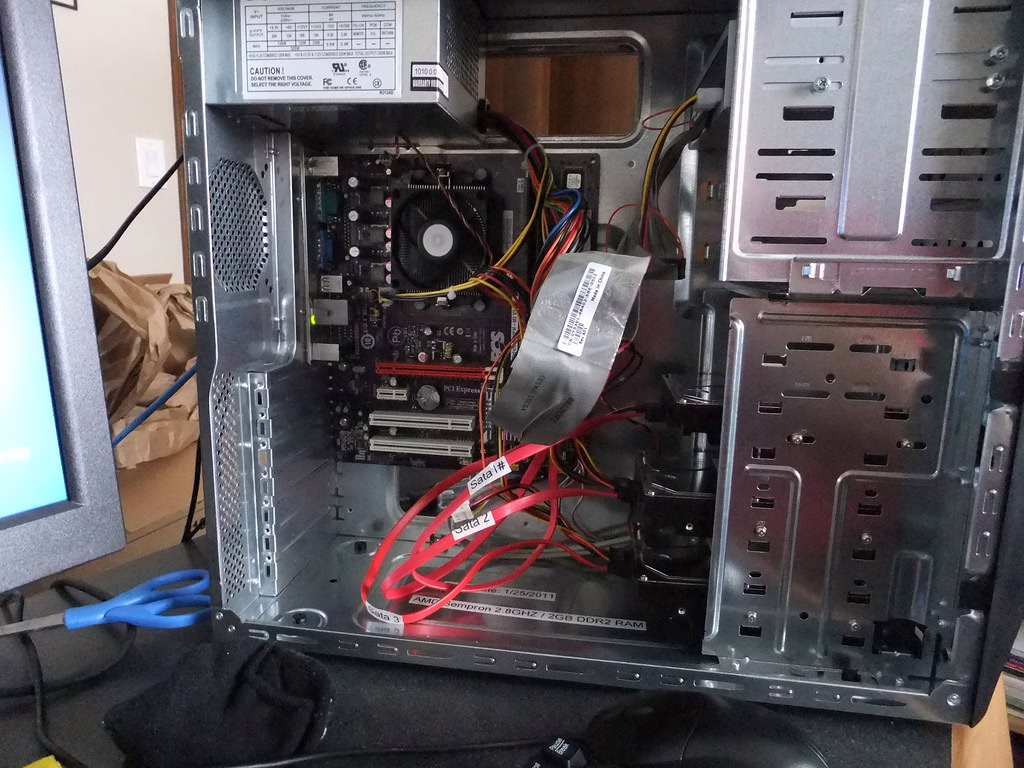 Open home server hardware sitting on a work surface during a rebuild